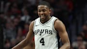 Nov 26, 2025; Portland, Oregon, USA; San Antonio Spurs guard De'Aaron Fox (4) reacts after making a three-point shot in the second half against the Portland Trail Blazers at Moda Center. Mandatory Credit: Jaime Valdez-Imagn Images