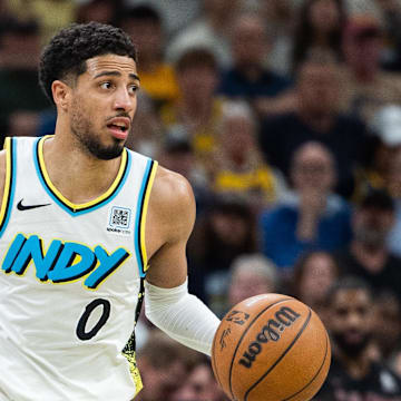 May 11, 2025; Indianapolis, Indiana, USA; Indiana Pacers guard Tyrese Haliburton (0) dribbles the ball during game four of the second round for the 2025 NBA Playoffs against the Cleveland Cavaliers at Gainbridge Fieldhouse. Mandatory Credit: Trevor Ruszkowski-Imagn Images
