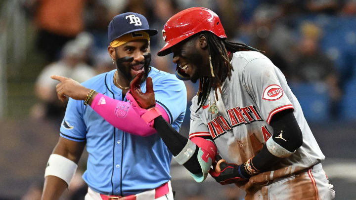 Jul 28, 2024; St. Petersburg, Florida, USA; Tampa Bay Rays first baseman Yandy Diaz (2) and Cincinnati Reds short stop Elly De La Cruz (44) chat during the sixth inning  at Tropicana Field. Mandatory Credit: Jonathan Dyer-USA TODAY Sports