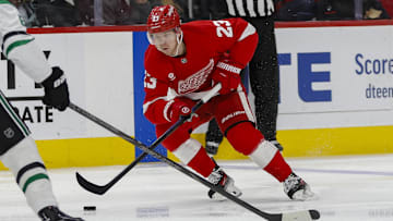 Apr 14, 2025; Detroit, Michigan, USA; Detroit Red Wings left wing Lucas Raymond (23) handles the puck during the second period against the Dallas Stars at Little Caesars Arena. Mandatory Credit: Brian Bradshaw Sevald-Imagn Images