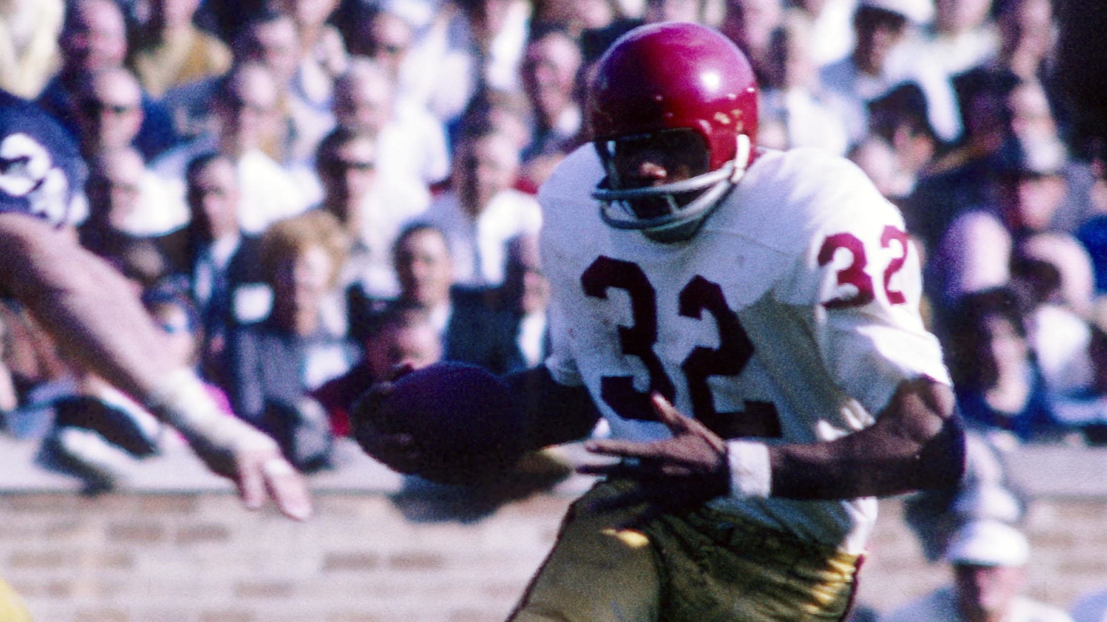 USC Trojans running back O.J. Simpson on a rushing attempt during a college football game.