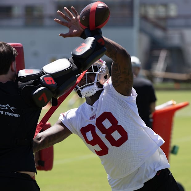 San Francisco 49ers defensive lineman Mikel Williams (98) bats at a ball as part of a rushing drill during the teamís rookie 