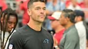 Sep 14, 2025; Glendale, Arizona, USA; Carolina Panthers head coach Dave Canales enters the field prior to the first half against the Arizona Cardinals the at State Farm Stadium. 