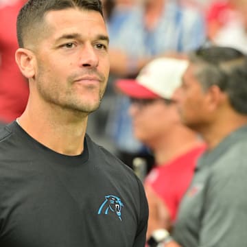 Sep 14, 2025; Glendale, Arizona, USA; Carolina Panthers head coach Dave Canales enters the field prior to the first half against the Arizona Cardinals the at State Farm Stadium. 