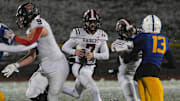 Quarterback Dylan Fox (7) competes for the Port Jervis varsity football team last season.
