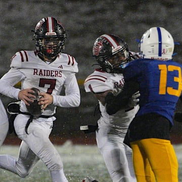 Quarterback Dylan Fox (7) competes for the Port Jervis varsity football team last season.
