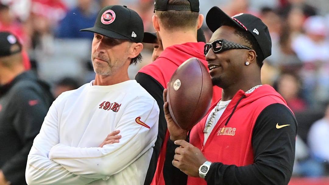 Jan 5, 2025; Glendale, Arizona, USA; San Francisco 49ers head coach Kyle Shanahan (left) and wide receiver Deebo Samuel Sr. (right) look on prior to the game against the Arizona Cardinals at State Farm Stadium. Mandatory Credit: Matt Kartozian-Imagn Images