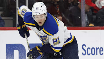 Dec 23, 2024; Detroit, Michigan, USA;  St. Louis Blues center Dylan Holloway (81) skates with the puck in the first period against the Detroit Red Wings at Little Caesars Arena. Mandatory Credit: Rick Osentoski-Imagn Images