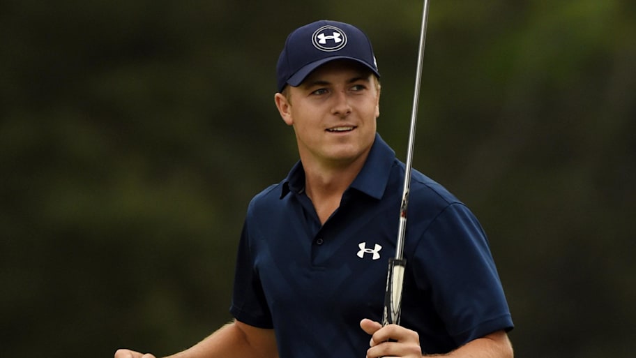 Jordan Spieth celebrates after completing the 18th hole to win The Masters golf tournament at Augusta National