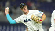 Miami Marlins first baseman Eric Wagaman (33) throws out St. Louis Cardinals center fielder Nathan Church (27) in the fifth inning at loanDepot Park. 