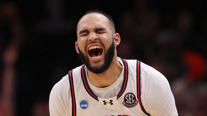 Auburn Tigers forward Johni Broome (4) celebrates after a play during the second half in the South Regional final of the 2025 NCAA tournament against the Michigan State Spartans at State Farm Arena on March 30, 2025.