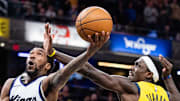 Sacramento Kings guard Malik Monk shoots the ball while Indiana Pacers forward Obi Toppin and forward Pascal Siakam defend