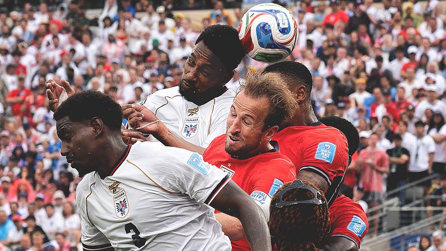 Harry Kane (center) heading the ball.