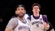 Mar 21, 2024; Brooklyn, NY, USA; Northwestern Wildcats guard Brooks Barnhizer (13) and Northwestern Wildcats guard Boo Buie (0) run drills during team practice at Barclays Center. Mandatory Credit: Brad Penner-Imagn Images