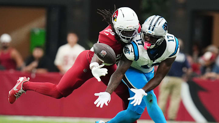 Arizona Cardinals cornerback Denzel Burke (29) makes a defensive stop against Carolina Panthers receiver Xavier Legette (17) at State Farm Stadium on Sept 14, 2025.