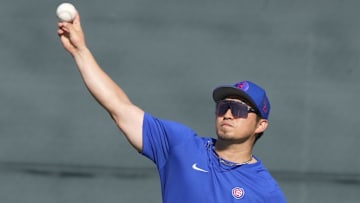 Feb 20, 2023; Mesa, AZ, USA; Chicago Cubs right fielder Seiya Suzuki (27) takes fielding practice