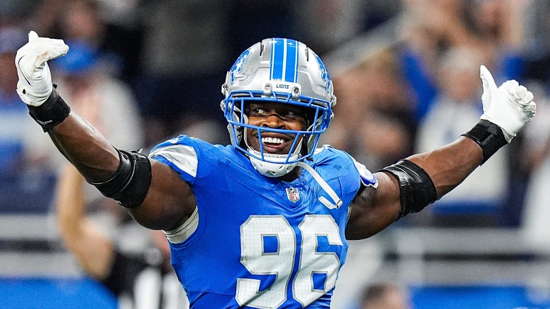 Detroit Lions linebacker Al-Quadin Muhammad (96) celebrates a tackle against Chicago Bears during the second half at Ford Field in Detroit on Sunday, Sept. 14, 2025.