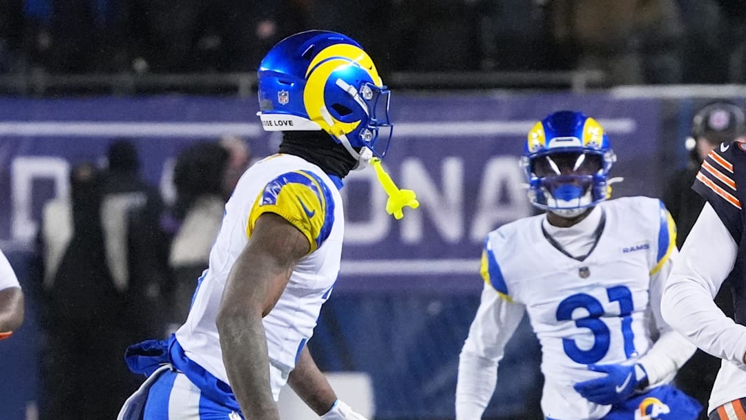 Jan 18, 2026; Chicago, IL, USA; Chicago Bears quarterback Caleb Williams (18) runs with the ball against Los Angeles Rams cornerback Darious Williams (31) during the fourth quarter of an NFC Divisional Round game at Soldier Field. Mandatory Credit: David Banks-Imagn Images