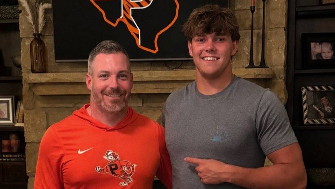 Austin Moilan and Princeton inside linebackers' coach Mike Weick
