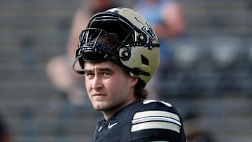 Purdue Boilermakers punter Keelan Crimmins (30) looks down field Saturday, Aug. 31, 2024, ahead of the NCAA football game at Ross-Ade Stadium in West Lafayette, Ind.