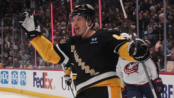 Jan 7, 2025; Pittsburgh, Pennsylvania, USA; Pittsburgh Penguins right wing Rickard Rakell (67) reacts after scoring a goal against the Columbus Blue Jackets during the third period at PPG Paints Arena. Mandatory Credit: Charles LeClaire-Imagn Images