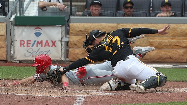 Pittsburgh Pirates catcher Henry Davis tags Cincinnati Reds first baseman Spencer Steer out at home plate attempting to score a run during the sixth inning at PNC Park. Pittsburgh Pirates catcher Henry Davis tags Cincinnati Reds first baseman Spencer Steer out at home plate attempting to score a run during the sixth inning at PNC Park.