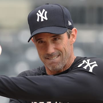 Apr 4, 2025; Pittsburgh, Pennsylvania, USA;  New York Yankees bench coach Brad Ausmus (68) participates in bating and infield practice before the game against the Pittsburgh Pirates at PNC Park. Mandatory Credit: Charles LeClaire-Imagn Images