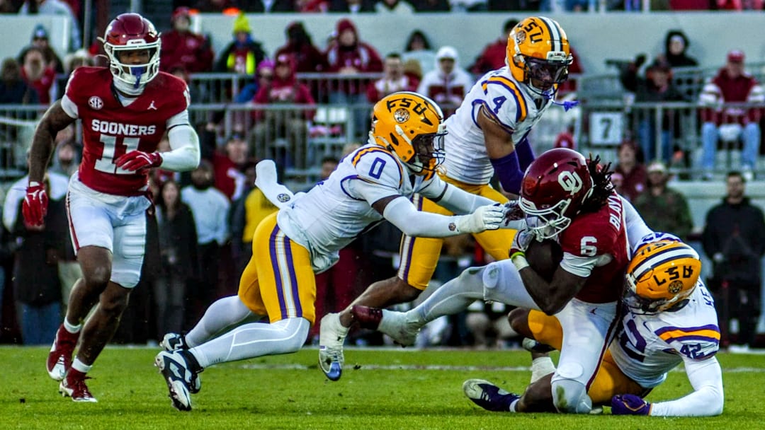 Oklahoma running back Tory Blaylock fights through a tackle against LSU.
