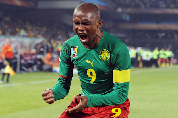 Cameroon forward Samuel Eto'o celebrates after scoring a goal during Group E play against Denmark.