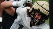 Purdue Boilermakers outside linebacker Will Heldt (15) runs a drill during football practice,
