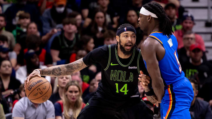 Apr 29, 2024; New Orleans, Louisiana, USA; New Orleans Pelicans forward Brandon Ingram (14) dribbles against Oklahoma City Thunder guard Luguentz Dort (5) during the second half of game four of the first round for the 2024 NBA playoffs at Smoothie King Center. 