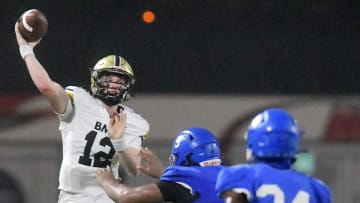 Bishop Moore's quarterback Bjorn Jurgensen (12) throws on the run during fourth quarter action. Orlando  s Bishop Moore High School traveled to Jacksonville  s Riverside High School for the Class 3M football Playoffs Friday, November 17, 2023. The Riverside Generals trailed 22 to 13 at the half and battled back in the second half but fell short, ending their season with a 37 to 35 loss to the Bishop Moore Hornets.