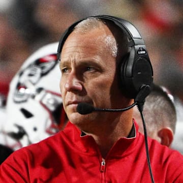 Nov 1, 2025; Raleigh, North Carolina, USA;  NC State Wolfpack head coach Dave Doeren during the first quarter at Carter-Finley Stadium. Mandatory Credit: Zachary Taft-Imagn Images