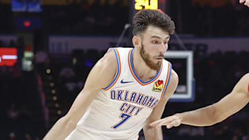 Oct 9, 2024; Oklahoma City, Oklahoma, USA; Oklahoma City Thunder forward Chet Holmgren (7) drives around Houston Rockets guard Reed Sheppard (15) during the second quarter at Paycom Center. Mandatory Credit: Alonzo Adams-Imagn Images