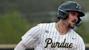 Purdue infielder Logan Sutter (10) rounds the bases after hitting a home run 