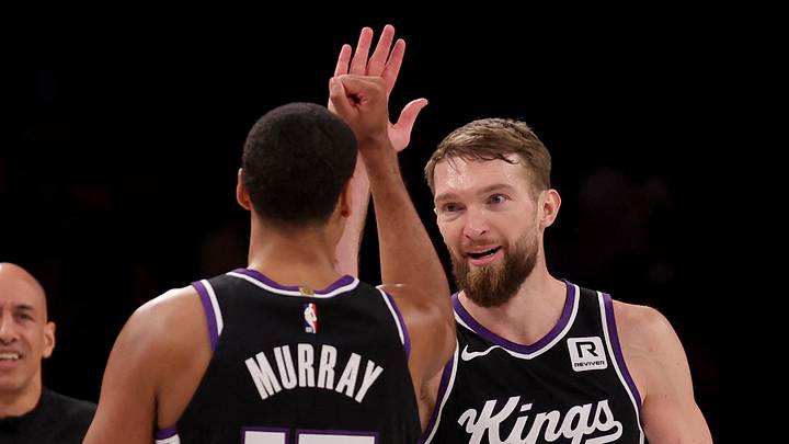 Jan 27, 2025; Brooklyn, New York, USA; Sacramento Kings forward Domantas Sabonis (11) celebrates his three point shot against the Brooklyn Nets with forward Keegan Murray (13) during the fourth quarter at Barclays Center. Mandatory Credit: Brad Penner-Imagn Images