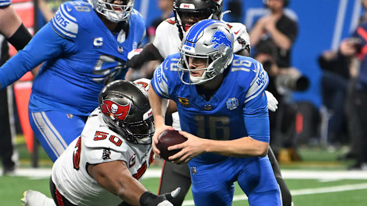 Jan 21, 2024; Detroit, Michigan, USA; Detroit Lions quarterback Jared Goff (16) runs with the ball against Tampa Bay Buccaneers defensive tackle Vita Vea (50) during the second half in a 2024 NFC divisional round game at Ford Field. Mandatory Credit: Lon Horwedel-Imagn Images