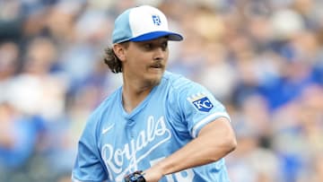 Mar 27, 2025; Kansas City, Missouri, USA; Kansas City Royals relief pitcher Hunter Harvey (56) pitches during the eighth inning against the Cleveland Guardians at Kauffman Stadium. Mandatory Credit: Jay Biggerstaff-Imagn Images