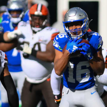 Oct 29, 2023; Seattle, Washington, USA; Seattle Seahawks wide receiver Tyler Lockett (16) carries the ball after making a catch against the Cleveland Browns at Lumen Field. Mandatory Credit: Steven Bisig-USA TODAY Sports