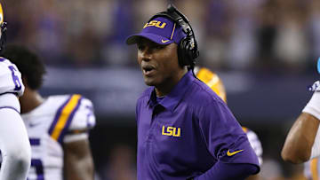 Aug 31, 2013; Arlington, TX, USA; LSU Tigers defensive backs coach Corey Raymond on the sidelines during the game against the Texas Christian Horned Frogs at AT&T Stadium. Mandatory Credit: Matthew Emmons-Imagn Images