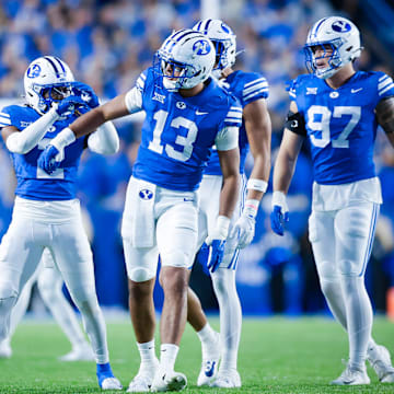 BYU defensive end Tausili Akana celebrates a tackle for loss against TCU
