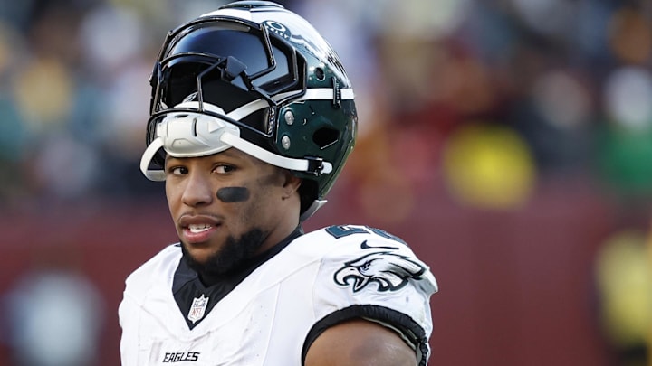 Philadelphia Eagles running back Saquon Barkley stands on the field.
