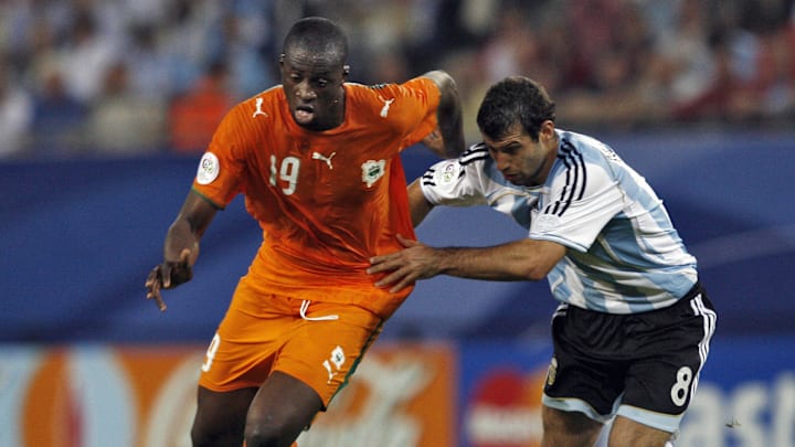 Ivorian midfielder Yaya Toure (L) vies w