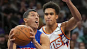 Oct 11, 2024; Phoenix, Arizona, USA; Detroit Pistons forward Simone Fontecchio (19) drives against Phoenix Suns center Oso Ighodaro (4) during the second half at Footprint Center. Mandatory Credit: Joe Camporeale-Imagn Images
