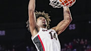 Nov 19, 2024; Athens, Georgia, USA; Georgia Bulldogs forward Asa Newell (14) dunks against the Alabama A&M Bulldogs during the first half at Stegeman Coliseum. Mandatory Credit: Dale Zanine-Imagn Images