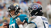 Jacksonville Jaguars quarterback Mac Jones is forced out of bounds by Tennessee Titans linebacker Jerome Baker.