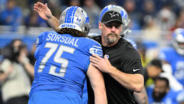 Detroit Lions head coach Dan Campbell hugs offensive tackle Colby Sorsdal (75) before a game against the Denver Broncos at Ford Field.