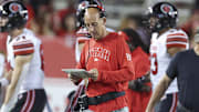 Oct 26, 2024; Houston, Texas, USA; Utah Utes offensive coordinator Mike Bajakian walks on the field during the game against the Houston Cougars at TDECU Stadium. Mandatory Credit: Troy Taormina-Imagn Images
