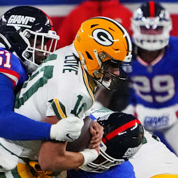 New York Giants defender Azeez Ojulari (51) sacks Green Bay Packers quarterback Jordan Love in 2023.