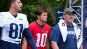 Patriots quarterback Drake Maye heads out to the field on the first day of training camp Wednesday morning.